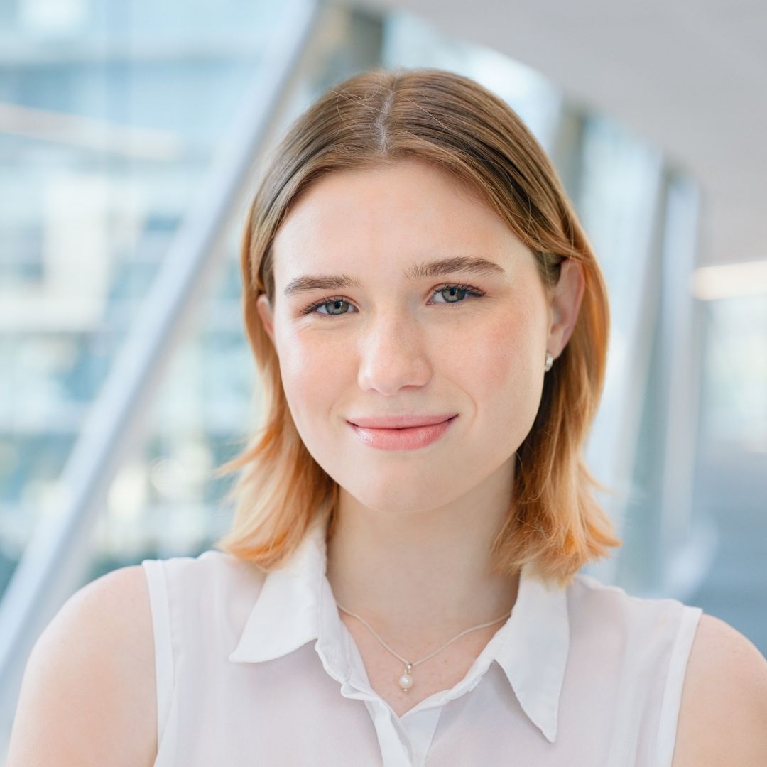 Smiling apprentice in a white blouse