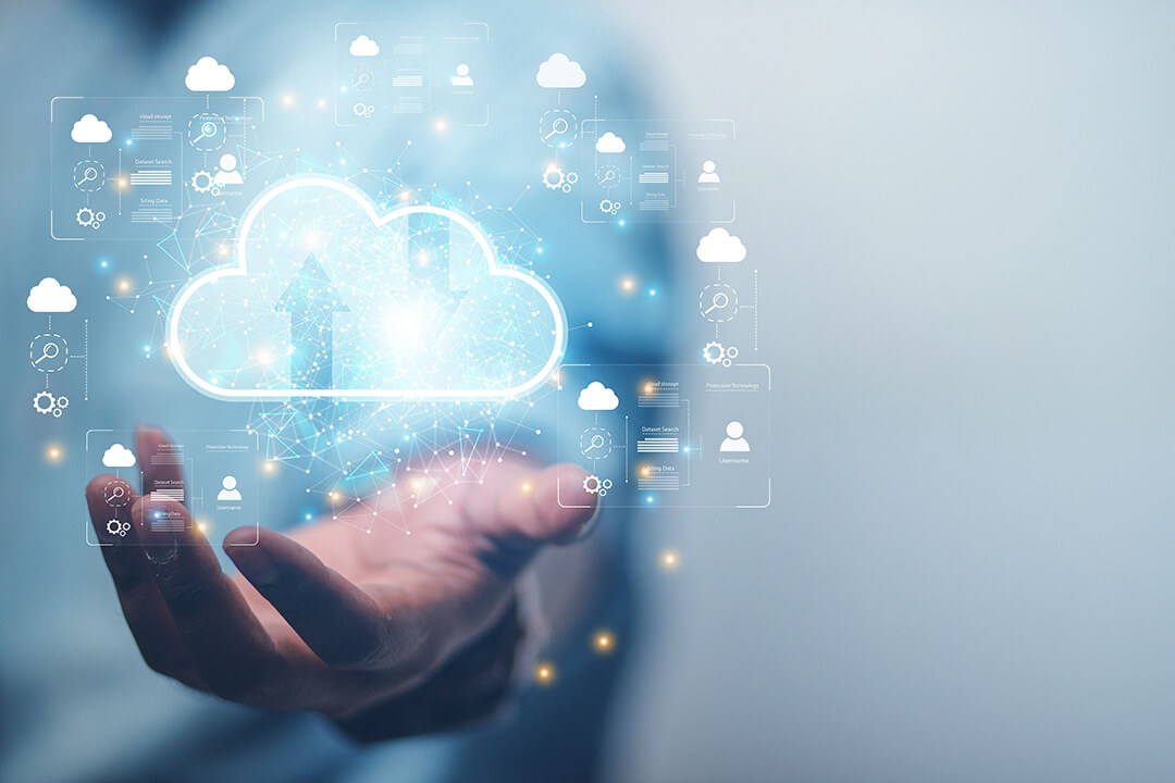 Hand holding a glowing cloud icon surrounded by digital data elements